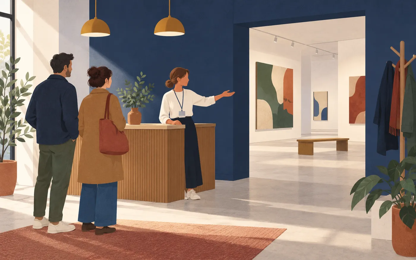 A staff member welcomes visitors to a cultural venue.
