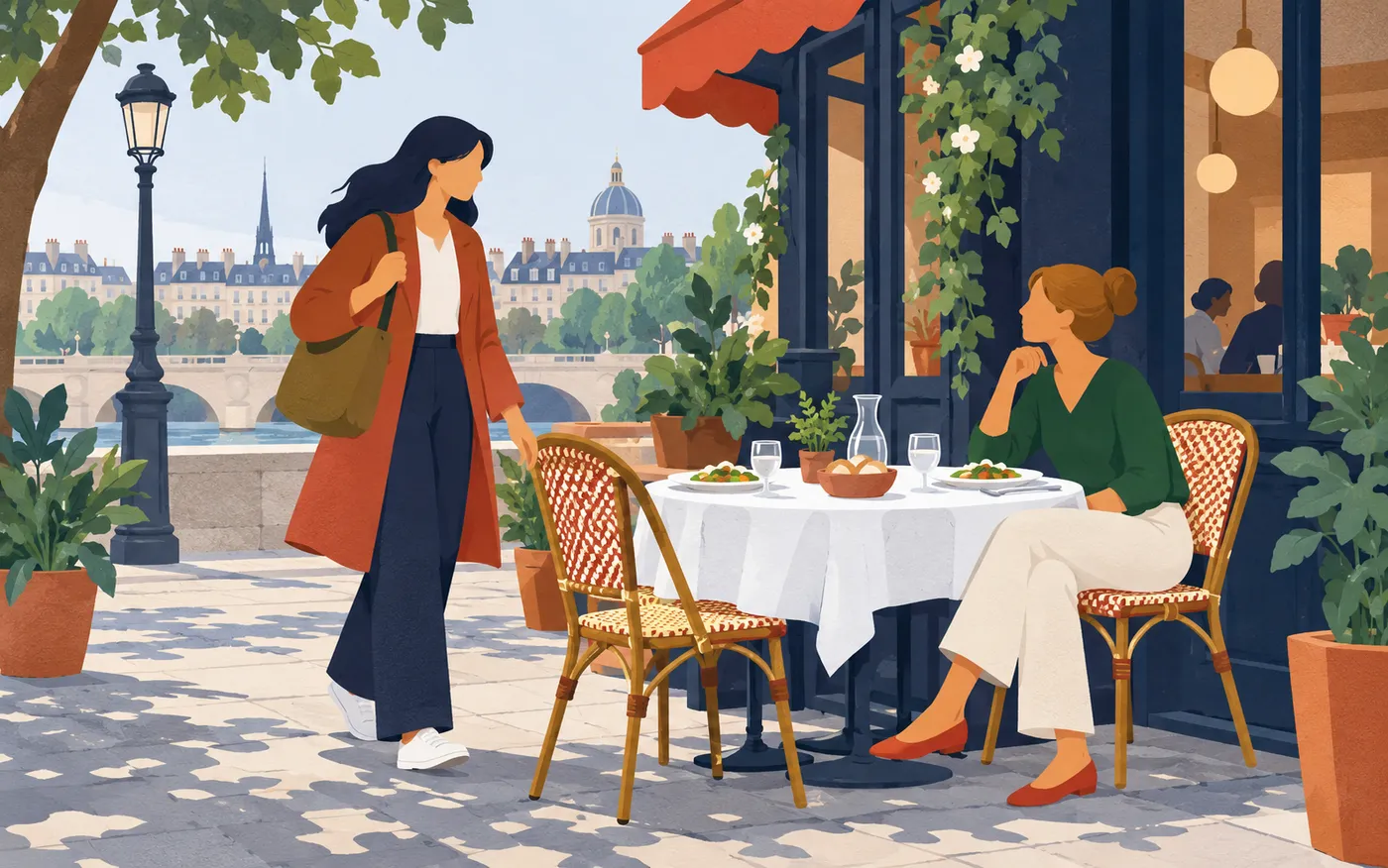 Two French colleagues meeting for lunch at a café table, one just arriving with a shoulder bag, plates ready.