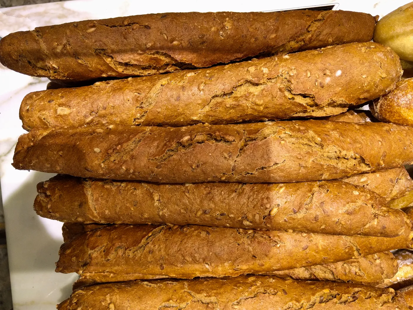 Baguettes stacked in a Paris bakery.